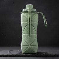 Foldo sage green foldable silicone water bottle with geometric origami fold design