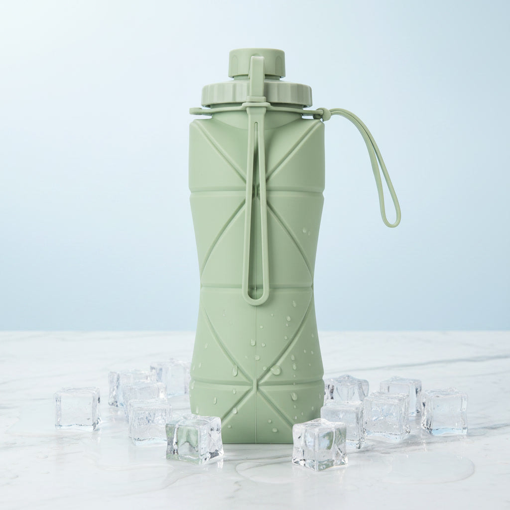 Foldo sage green foldable silicone water bottle showing origami fold body and cap